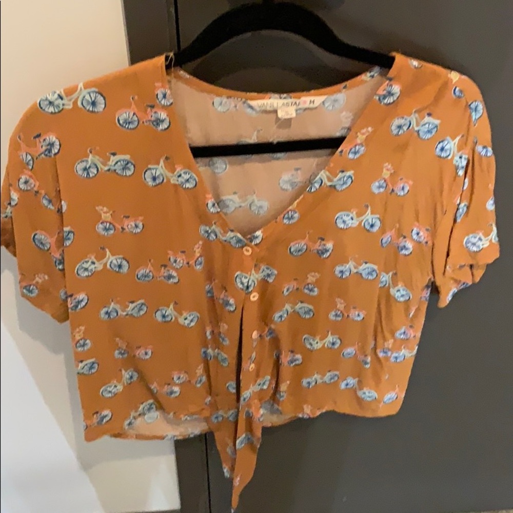 Yellow top with bikes and a tie in front